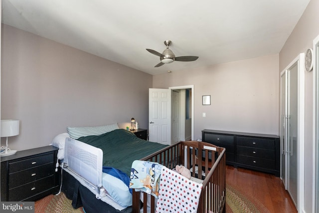 bedroom featuring dark hardwood / wood-style flooring and ceiling fan