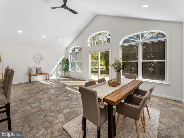 dining room with high vaulted ceiling and ceiling fan