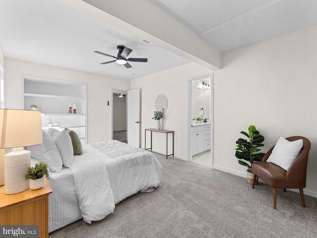 carpeted bedroom featuring ensuite bathroom and ceiling fan