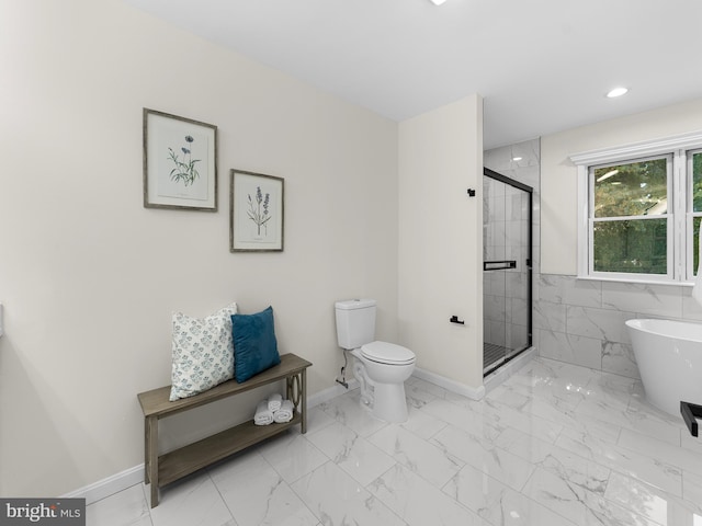 bathroom with shower with separate bathtub and toilet