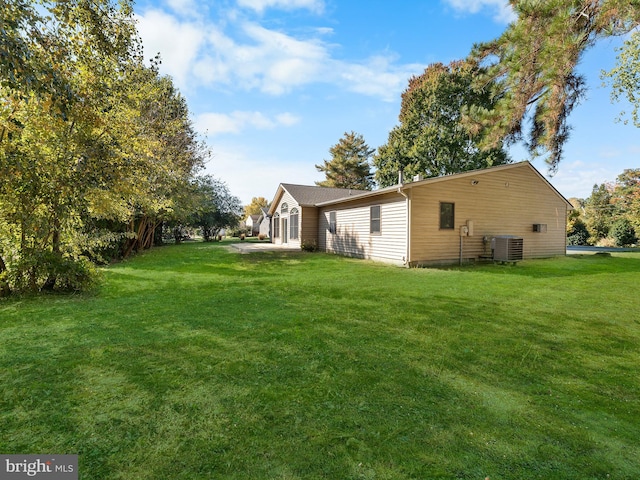 view of yard with central AC unit