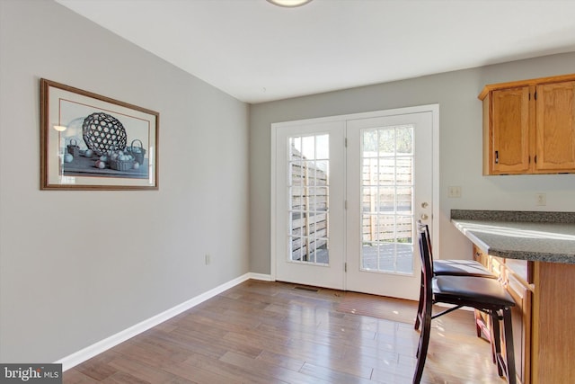 dining space with light hardwood / wood-style floors