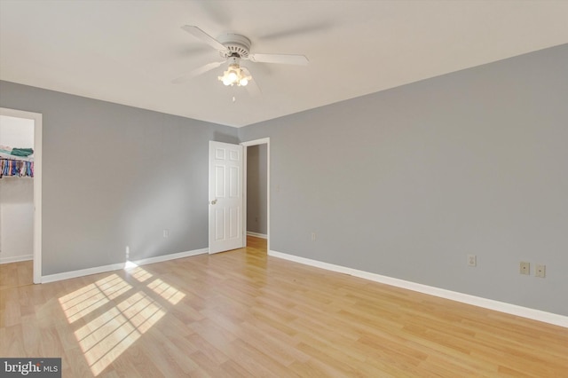 unfurnished room featuring light wood-type flooring and ceiling fan