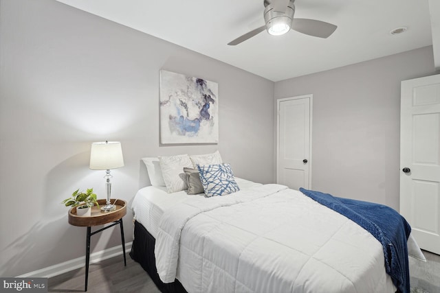 bedroom featuring hardwood / wood-style floors and ceiling fan