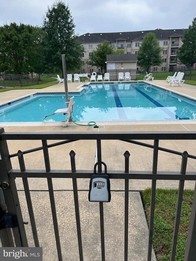 view of swimming pool with a patio area