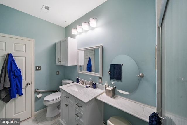 bathroom featuring vanity and toilet