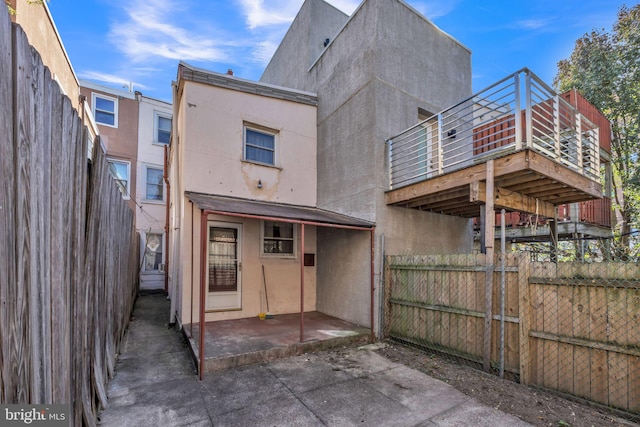 rear view of house with a patio