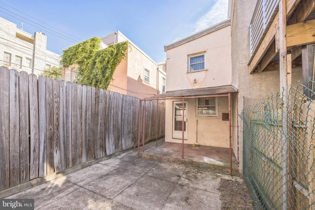 back of property with a patio area