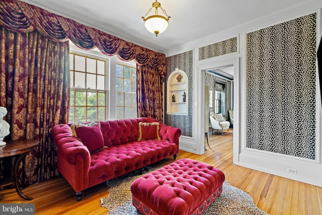 living room featuring ornamental molding and hardwood / wood-style floors