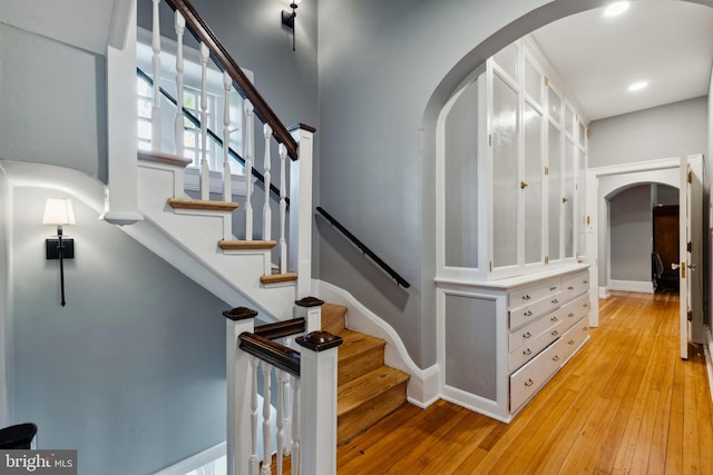 stairway featuring hardwood / wood-style flooring