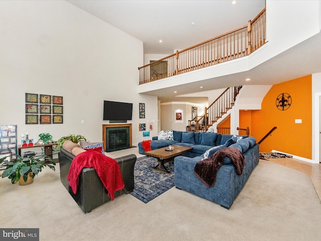 living room with carpet and a high ceiling