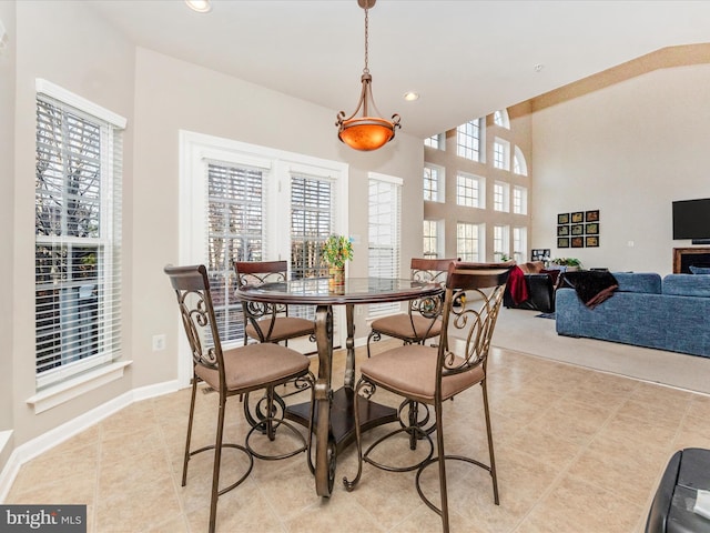 tiled dining room with plenty of natural light