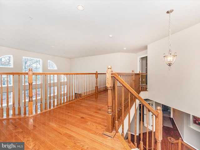 hall with hardwood / wood-style flooring