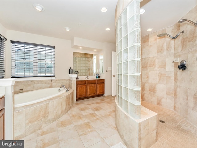 bathroom featuring tile patterned floors, vanity, and independent shower and bath