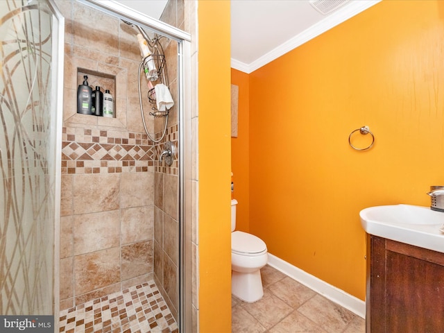 bathroom featuring tile patterned flooring, toilet, crown molding, and an enclosed shower