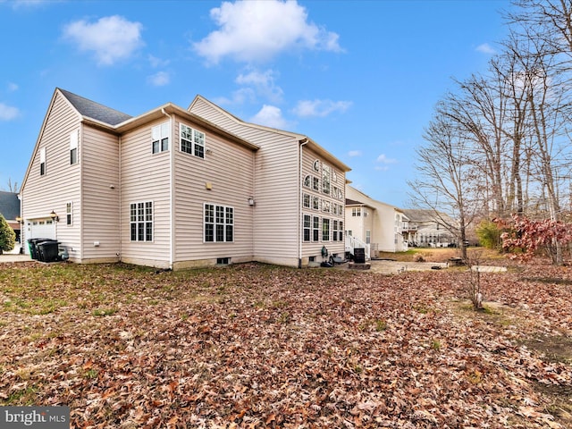 view of property exterior with a garage