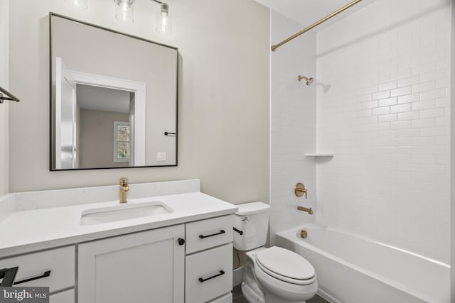 full bathroom with vanity, toilet, and tiled shower / bath