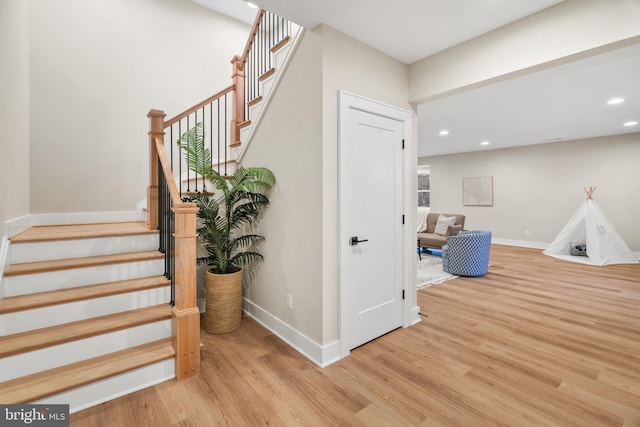 staircase featuring wood-type flooring