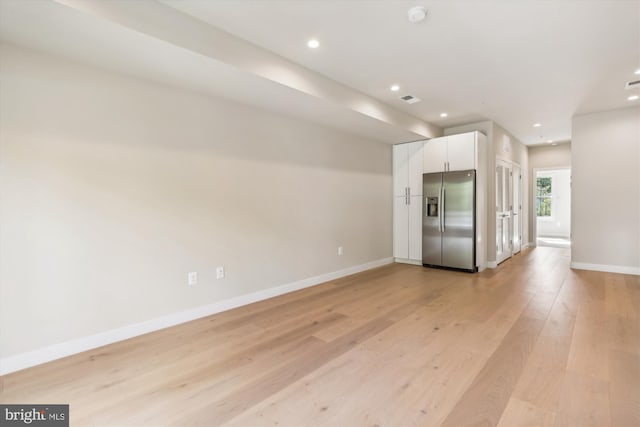 unfurnished living room with light hardwood / wood-style floors