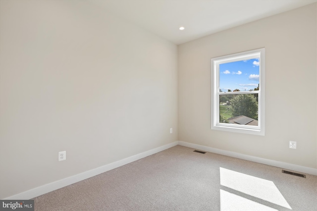 spare room featuring carpet floors