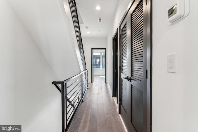 hall with dark hardwood / wood-style floors