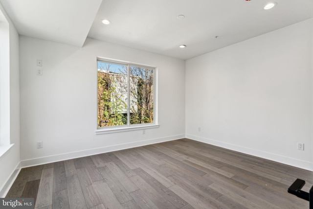 unfurnished room featuring hardwood / wood-style floors