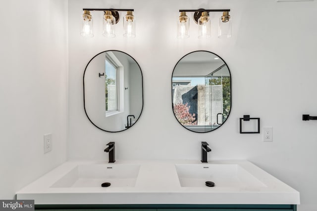 bathroom with vanity and a healthy amount of sunlight