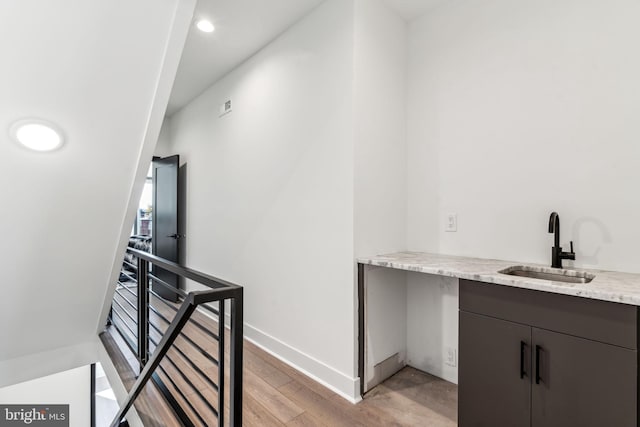 interior space with sink and light hardwood / wood-style flooring