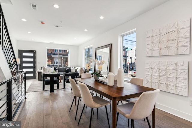 dining area featuring hardwood / wood-style flooring and plenty of natural light