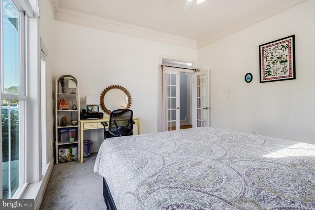 bedroom with french doors, carpet flooring, crown molding, and ceiling fan