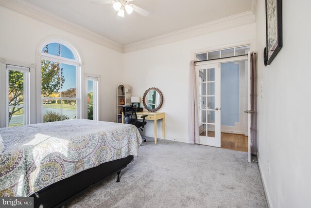 bedroom with french doors, ceiling fan, crown molding, and carpet