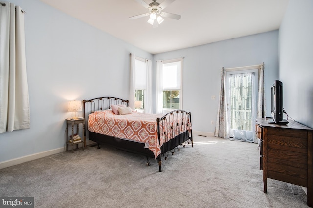 bedroom with ceiling fan, carpet, and baseboards