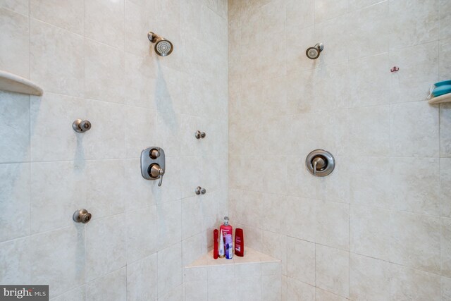 bathroom with a tile shower