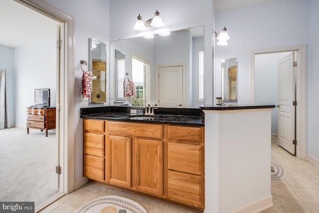 bathroom with tile patterned flooring and vanity