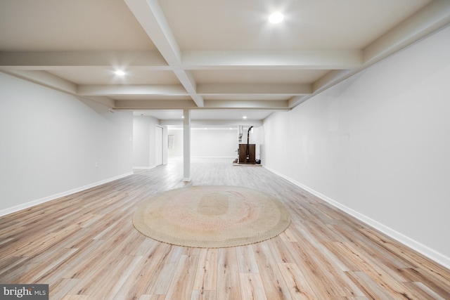 basement with light hardwood / wood-style flooring