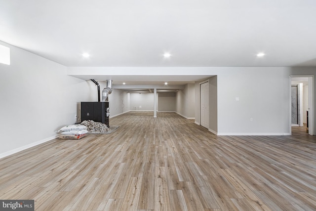 unfurnished living room featuring light wood-style floors, baseboards, and recessed lighting