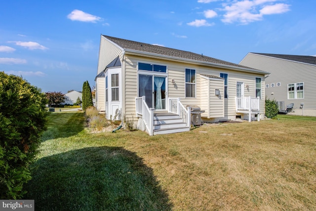 back of house with a yard