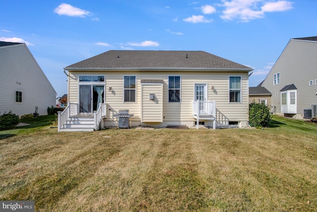 back of house with a yard and cooling unit
