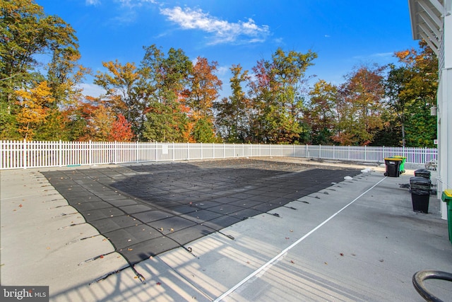 view of pool featuring a patio area, a fenced in pool, and fence