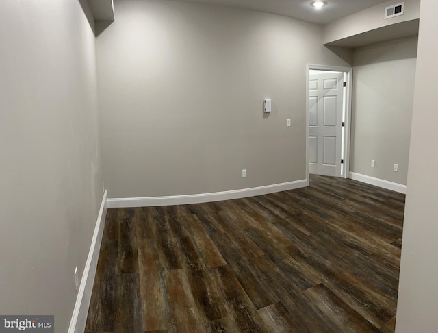 spare room with dark hardwood / wood-style floors