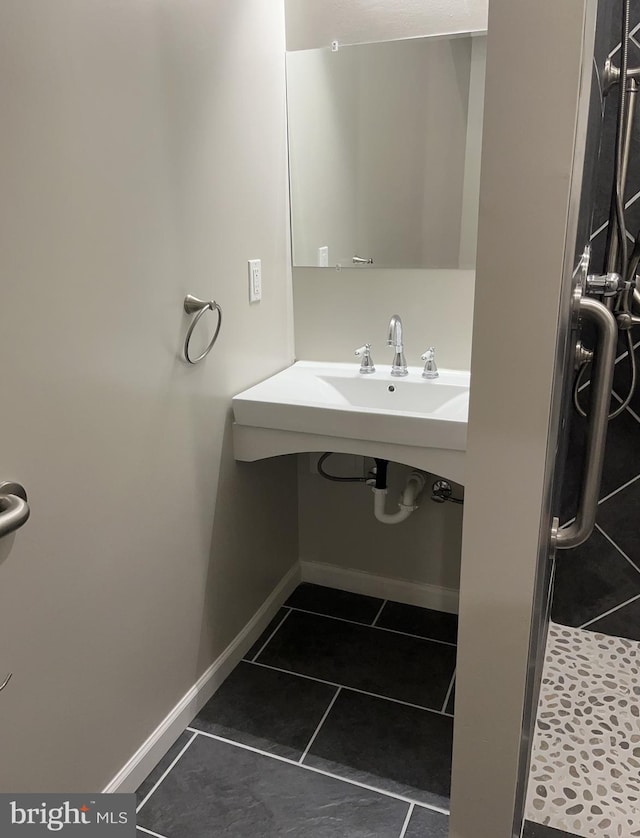 bathroom featuring a shower and tile patterned flooring