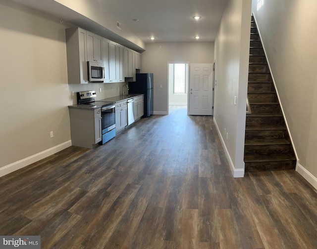 kitchen with sink, stainless steel appliances, and dark hardwood / wood-style floors