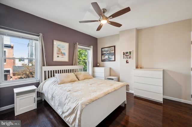 bedroom with ceiling fan and dark wood-type flooring