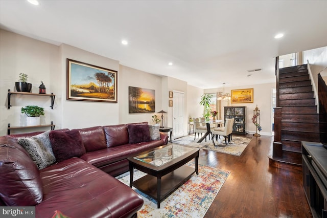 living room featuring dark hardwood / wood-style floors and plenty of natural light