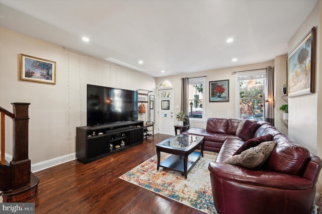 living room with dark hardwood / wood-style flooring