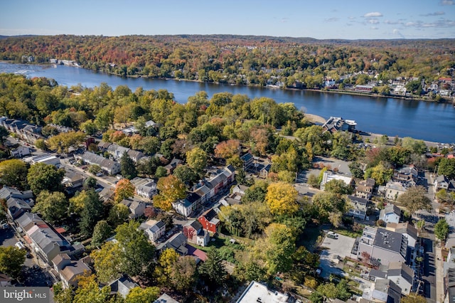 aerial view with a residential view, a wooded view, and a water view