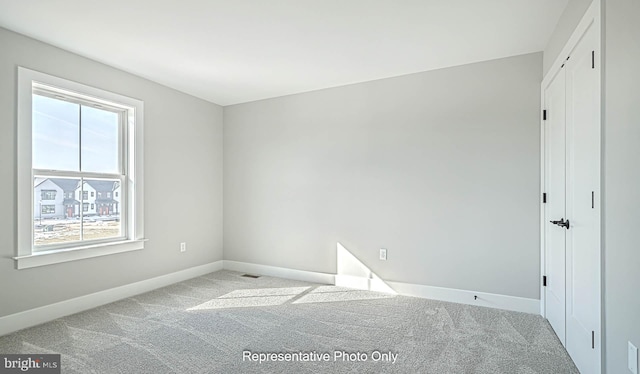 view of carpeted spare room