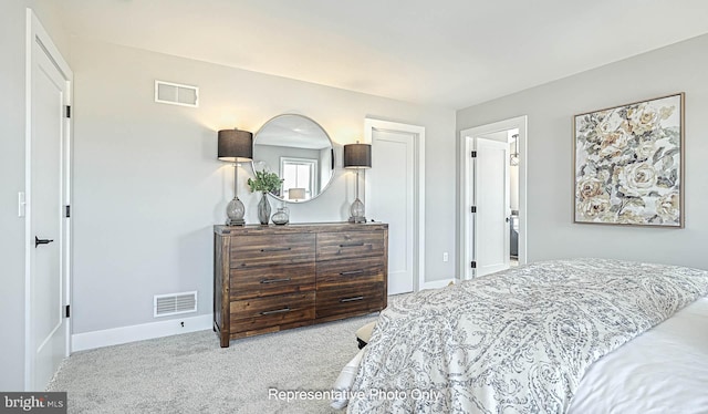 bedroom featuring light carpet