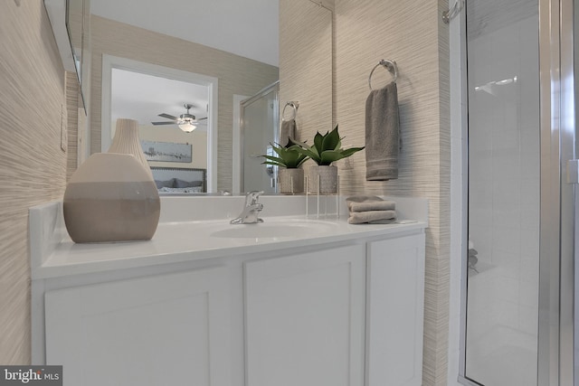 bathroom with an enclosed shower and vanity