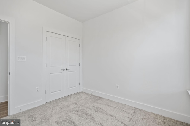 unfurnished bedroom featuring carpet flooring